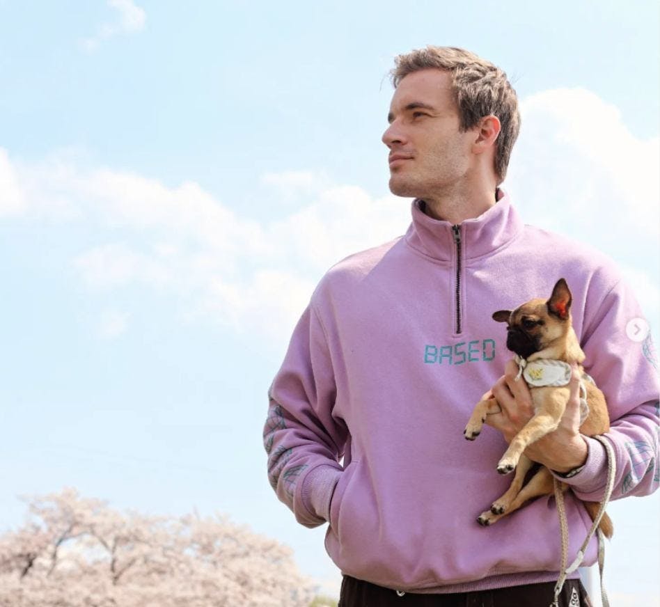 pewdiepie holding a dog