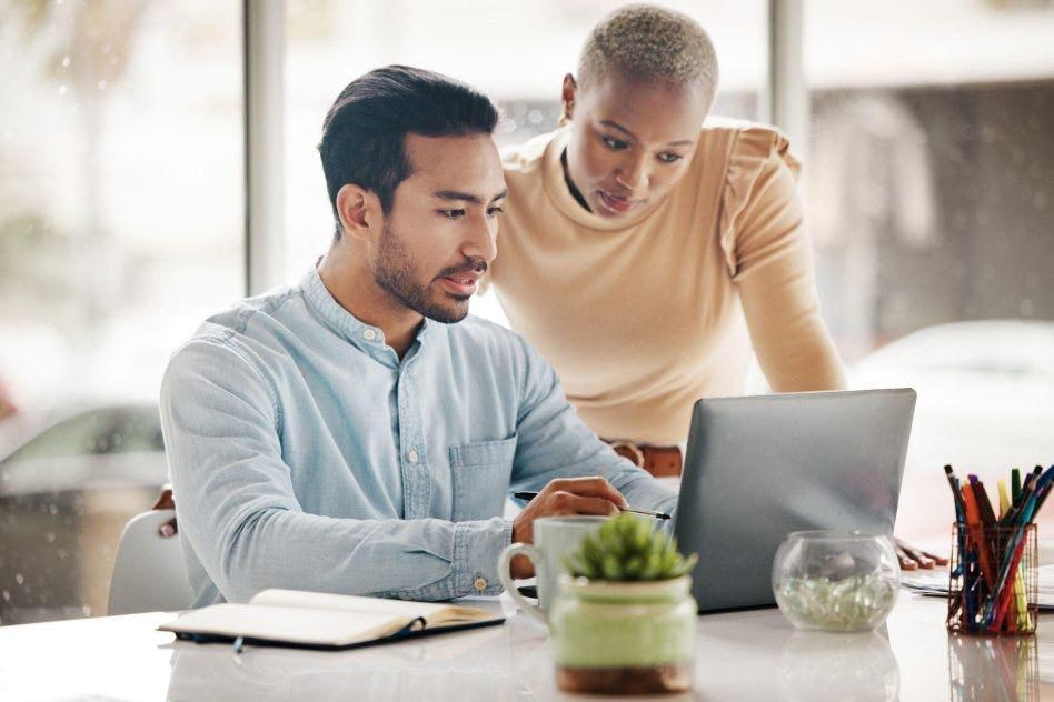 a male and female coworker reviewing a conduct contextual analysis